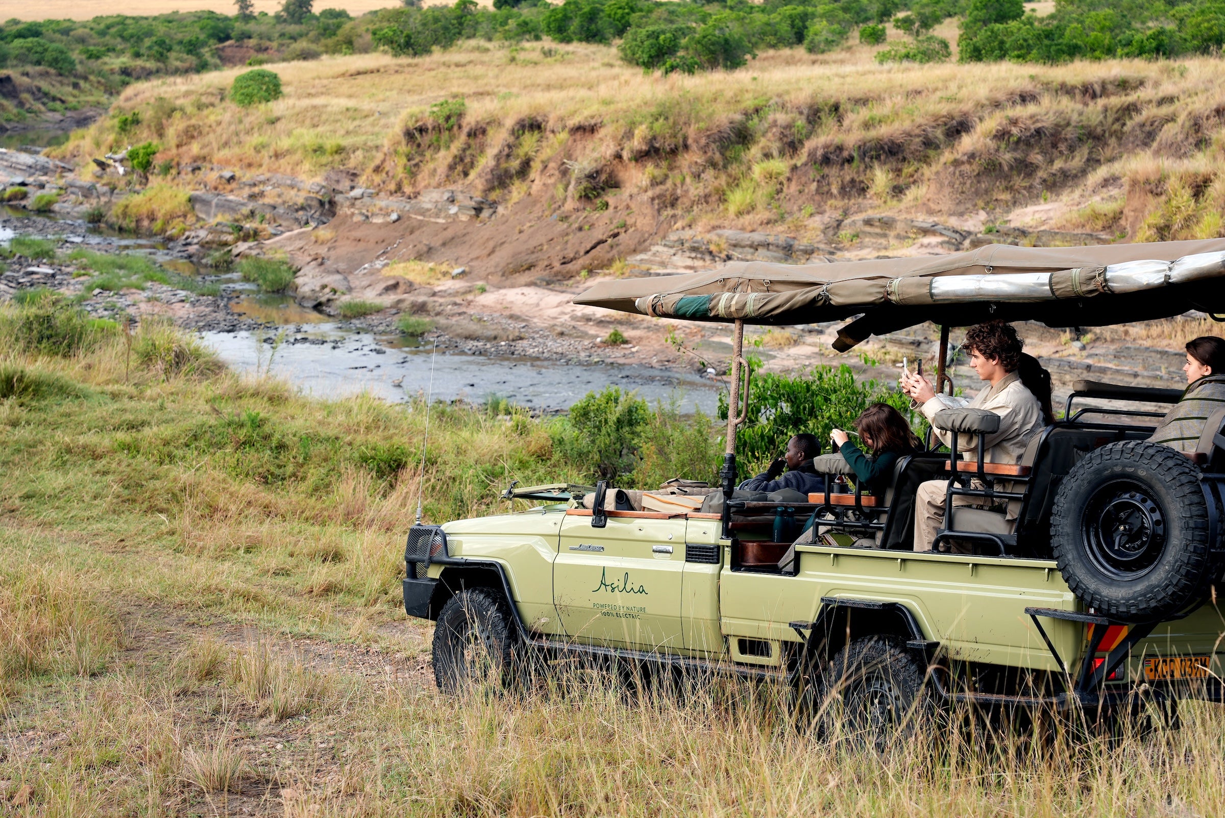 Open game drive vehicle at sunrise